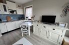 https://sylt-ferienhaus-ferienwohnung.de/wp-content/uploads/2025/04/WohnbereichKüche1.jpg